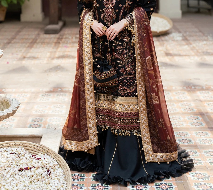 A black embroidered suit with a maroon embroidered dupatta